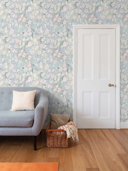 'Oops a daisy' wallpaper in pastel blue and pink colours